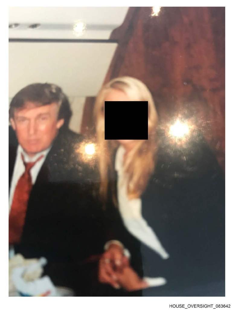 President Donald Trump with an unidentified person. 