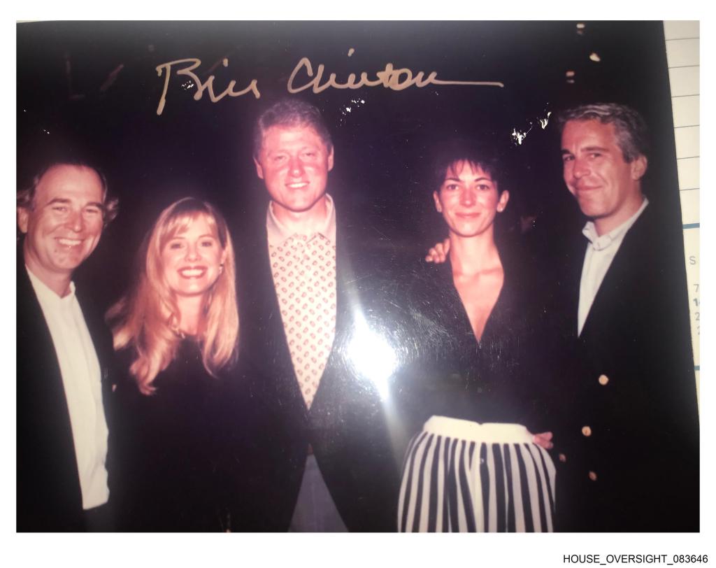 Jeffrey Epstein (far right), Ghislaine Maxwell (second from right) and former President Bill Clinton (middle) pose for a photo.